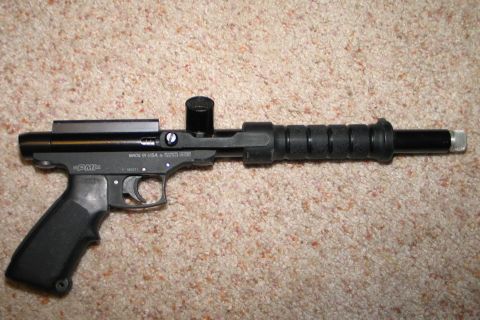 1994 Ford Bronco - A black PMI paintball gun is shown resting on a carpeted surface.