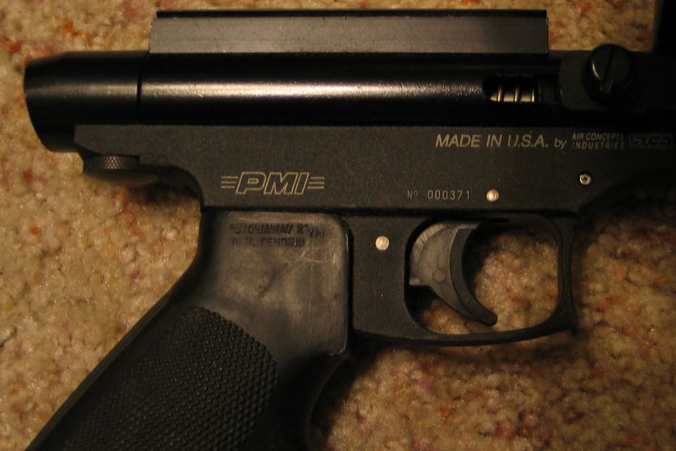Close-up of black air gun receiver with PMI logo and Made in USA text