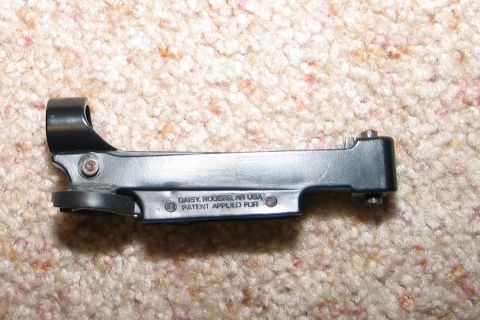 1994 Ford Bronco - A close-up view of a gun sight mount, showing manufacturer details and patent information.