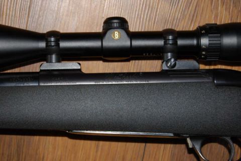 1991 Ford Bronco - Close-up of a rifle scope and receiver, showing the Bushnell logo and text indicating it was made in Japan.