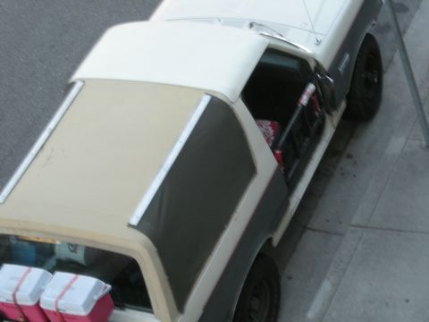 1991 Ford Bronco - A two-tone 1991 Ford Bronco is parked outdoors, viewed from above.