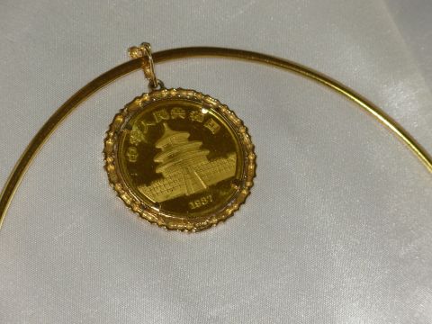 2004 Land Rover Land Rover - Gold panda coin pendant the Temple of Heaven and Chinese text, dated 1987.
