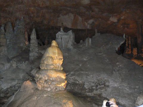 2006 Ford E350 - A view inside a cave, various natural rock formations like stalagmites and stalactites.