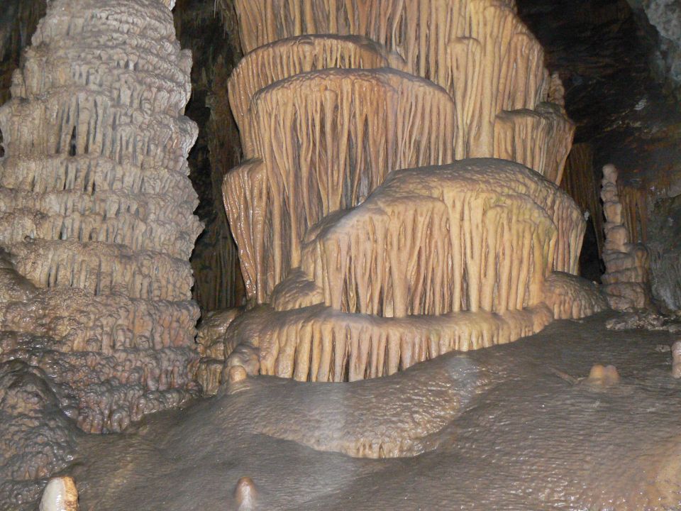Cave formations with stalactites and stalagmites