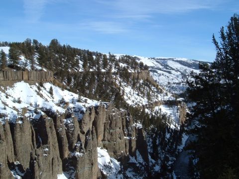 2006 Ford E350 - A vast canyon landscape covered in snow under a bright blue sky.