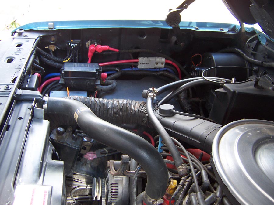 Relocated battery top back of truck and added a under hood fuse box plus some control relays to eliminate fuseable links