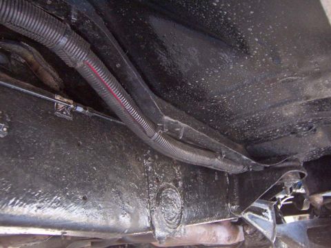 1983 Ford Bronco - Ran two number 2 battery cables encased in a black plastic wire shroud. Exiting the engine compartment.