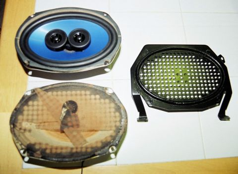1976 Ford Ranchero - Car audio parts including speakers and a grille are laid out on a tiled surface.