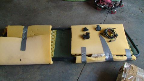 1979 Ford F-250 - Car window and associated electrical parts are prepared for transport with foam padding and duct tape.