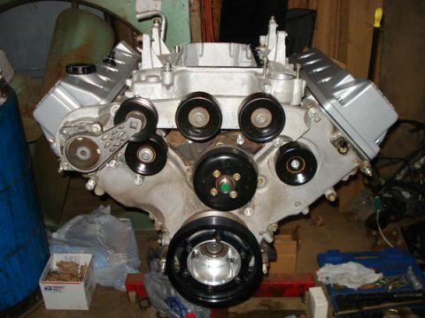2007 Ford Mustang - A V8 engine is shown, likely undergoing maintenance or assembly, with various components visible.