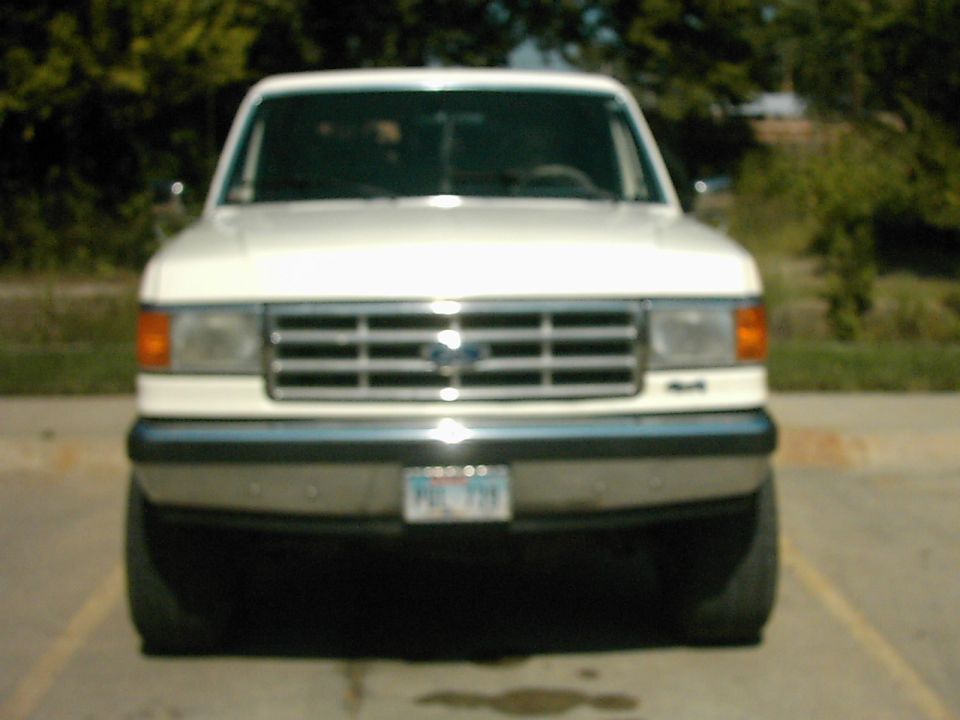 White 1987 Ford Bronco front view, chrome grille, license plate visible