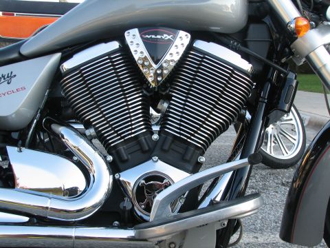 2006 Victory Kingpin - Close-up view of a Victory motorcycle's V-twin engine, showing chrome details and ribbed cylinders.