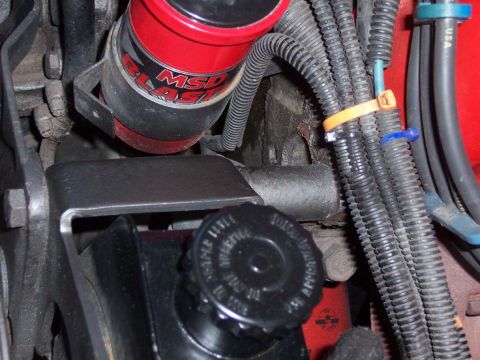 1983 Ford Bronco - Made spacer for mounting the pump. Seen behind the bracket that holds the pump.