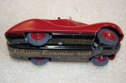 1968 Chrysler Town & Country - Underside view of a red Schuco Examico 4001 tin toy car made in Western Germany.