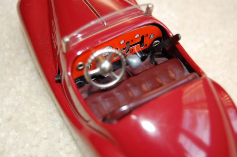 1968 Chrysler Town & Country - Close-up of a toy car's interior, highlighting the steering wheel and dashboard details.