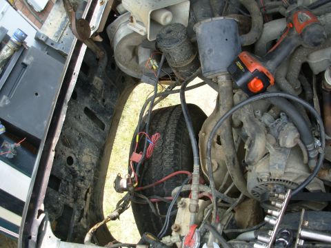 1983 Ford Bronco - First, I removed the battery, tray, starter relay, PA, coffee can, 2ndry air intake, & wheelwell for better access to the fender bolts.