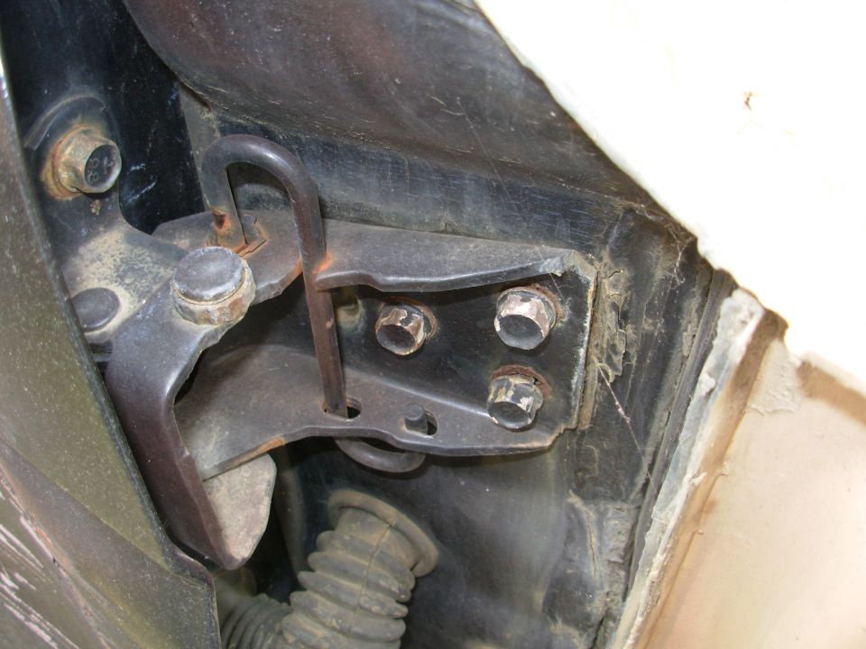 The last time I worked on the hinges, the fender was in-place, and apparently, I forgot to tighten the front 2 bolts.

For door alignment, see this post:
http://www.fourdoorbronco.com/board/showthread.php?6884-Door-Alignment

For more about Doors, see this album:
http://www.supermotors.net/registry/2742/19718-4

Go to the NEXT pic...