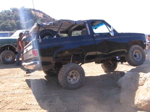 1989 Ford Bronco - This 1989 Ford Bronco is navigating a rocky trail with its soft top removed.