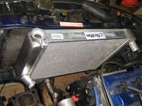 1995 Ford Probe - Engine bay components including a Griffin intercooler and radiator are shown during a turbo build.