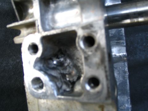 1987 Suzuki Samurai - Damaged transfer case housing shows internal wear and debris.