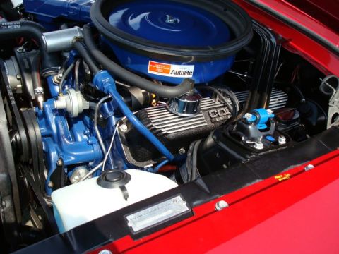 1968 Shelby GT500 - Close-up of a red 1968 Shelby GT500 engine bay, highlighting the blue Ford Cobra engine and Autolite air cleaner.