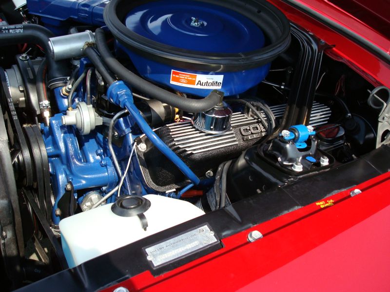 1968 Shelby GT500 engine bay with blue Ford Cobra engine components and Autolite air cleaner