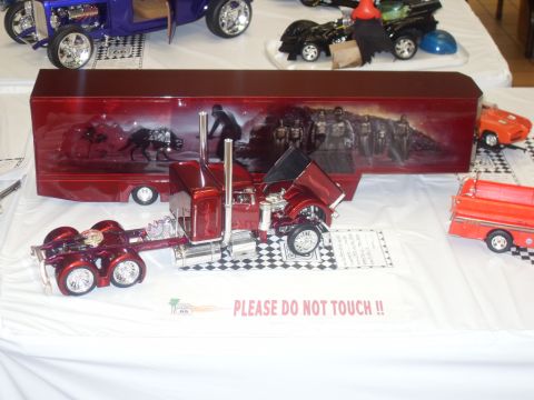 1990 Ford Bronco - A detailed model semi-truck and trailer display sits on a table with a 'Please Do Not Touch' sign.
