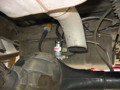 1979 Ford Bronco - Close-up view of the undercarriage components, including the rear axle and exhaust system.