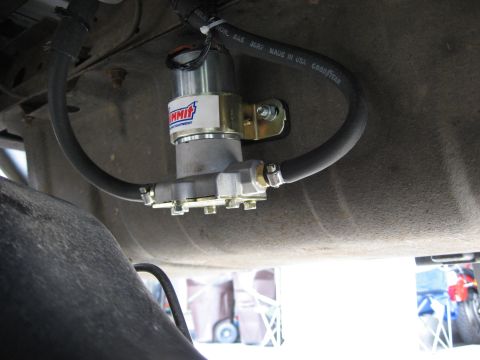 1979 Ford Bronco - A Summit fuel pump is installed on the underside of a vehicle, connected by hoses.