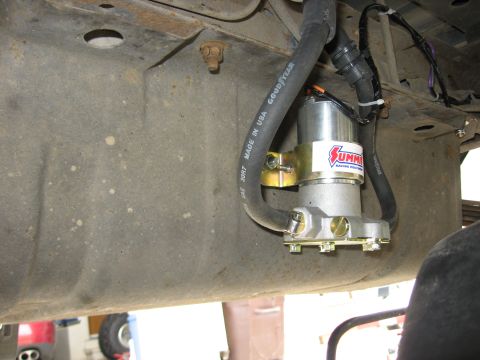 1979 Ford Bronco - Close-up of a Summit Racing fuel pump assembly attached to a vehicle's undercarriage.