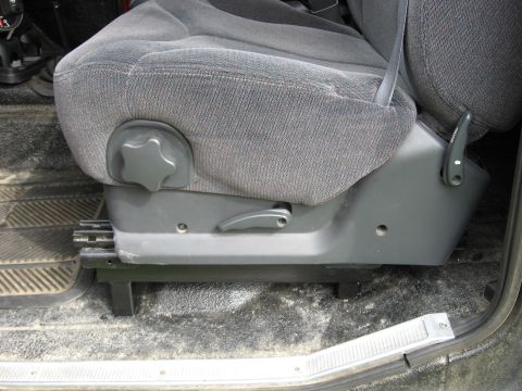 1979 Ford Bronco - Interior view of a vehicle's gray fabric seat with visible adjustment mechanisms.