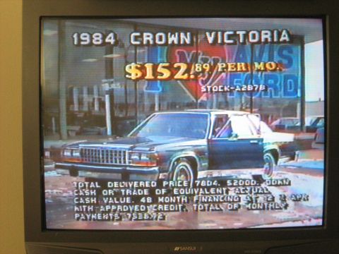 1988 Mercury Grand Marquis - Photo of a Sansui CRT television screen playing an old Davis Ford dealership commercial advertising a 1984 Crown Victoria at $152.89 per mo…