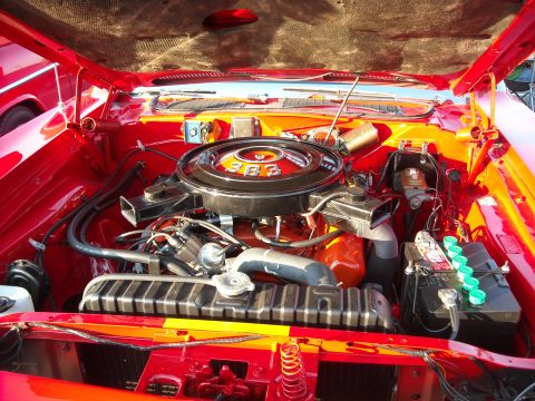 1979 Ford F-150 - The engine bay of a classic car, a prominent 383 cubic inch V8 engine with a chrome air cleaner.