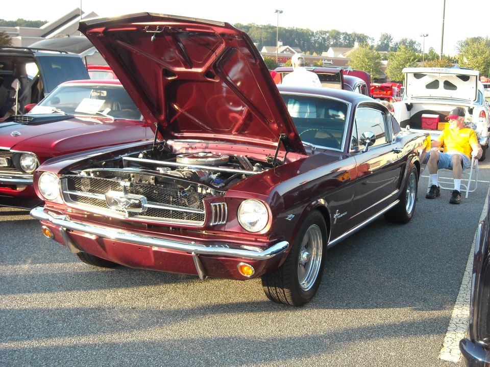 1970 Ford Mustang with hood open, parked at car show