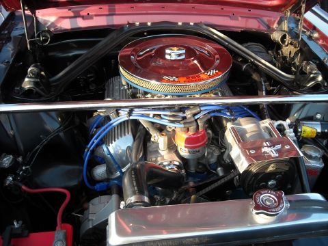 1979 Ford F-150 - Close-up view of the engine compartment, showing various engine parts and the air filter assembly.