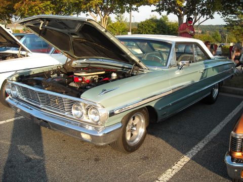 1979 Ford F-150 - Light blue and white 1963 Ford Galaxie 500XL at a car show, hood up.