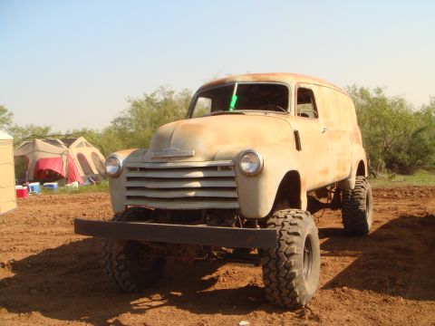1992 Ford Bronco - This lifted panel truck appears to be a mid-20th century Chevrolet, not a 1992 Ford Bronco.