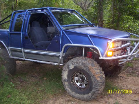 1978 Ford Bronco - This modified pickup truck features a full roll cage and is equipped for off-road use.