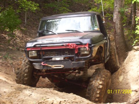 1978 Ford Bronco - This 1978 Ford Bronco navigates a challenging off-road trail with its front tires high off the ground.