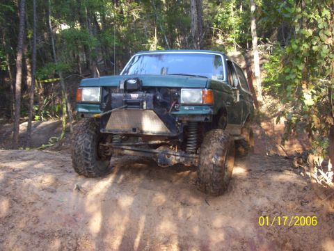 1978 Ford Bronco - This modified SUV navigates a challenging off-road course, its winch and lifted suspension.