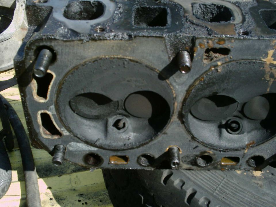 Close-up of a disassembled cylinder head combustion chambers