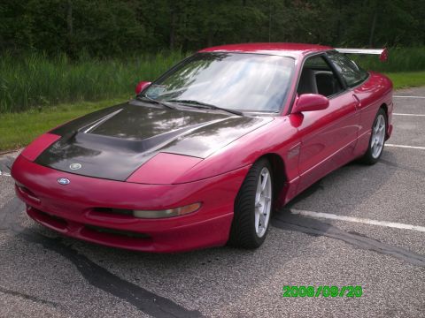 1994 Ford Probe - This 1994 Ford Probe features a carbon fiber hood and a prominent rear spoiler, giving it a sporty appearance.