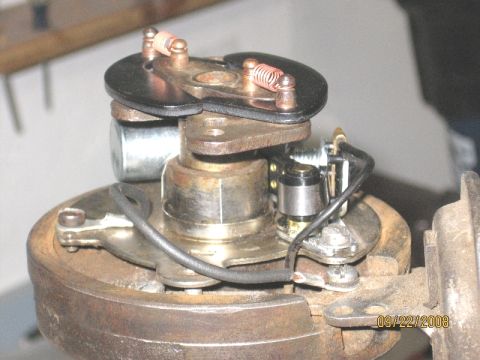 1961 International Scout 800 - Close-up view of a worn automotive distributor with visible wiring and mechanical components.