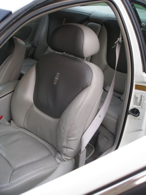 1998 Lincoln Mark VIII - Interior view of a 1998 Lincoln Mark VIII, showing the front seats and rear bench.