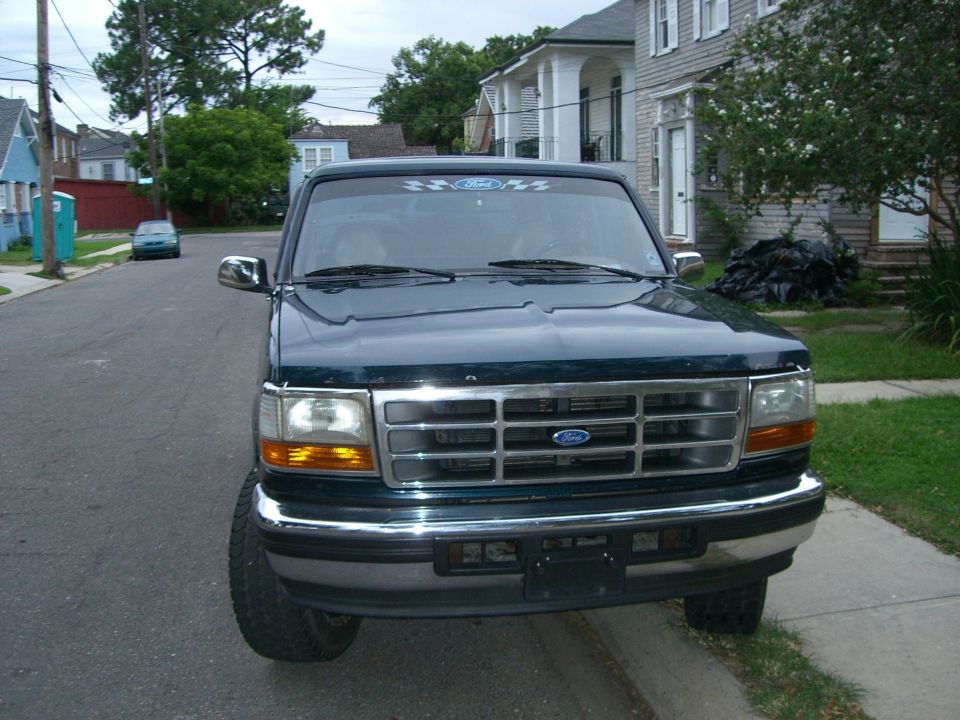 Front view of a 1995 Ford Bronco parked curbside on a street