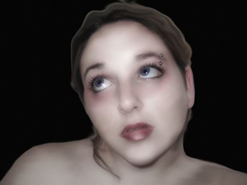1994 Ford Taurus - A woman with striking blue eyes and an eyebrow piercing is captured in a close-up portrait against a dark background.