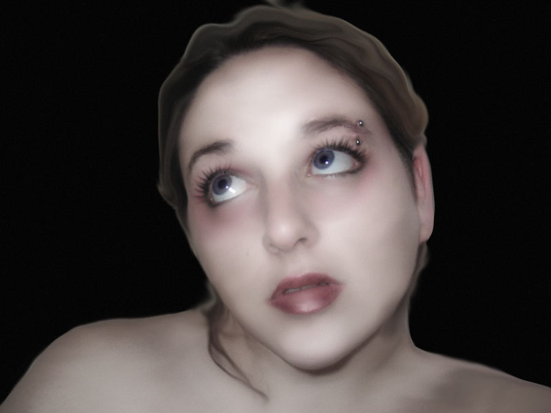 Woman with blue eyes and eyebrow piercing looking up