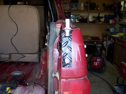 1991 Ford Bronco - Close-up of a CB antenna mount installed on the door frame of a vehicle.