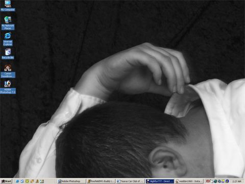 1994 Ford Taurus - A person's head and arm are visible against a dark background, with a computer desktop in the foreground.