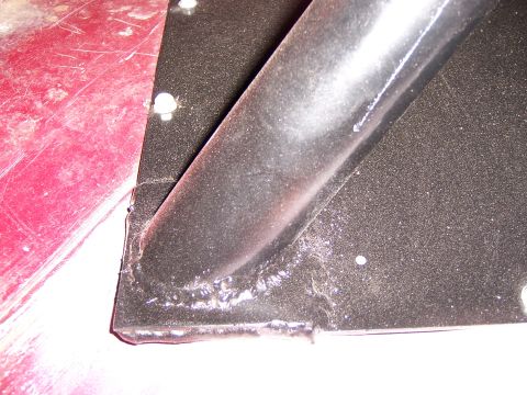 1991 Ford Bronco - This image shows a close-up of a welded metal bracket, not a 1991 Ford Bronco spare tire carrier.